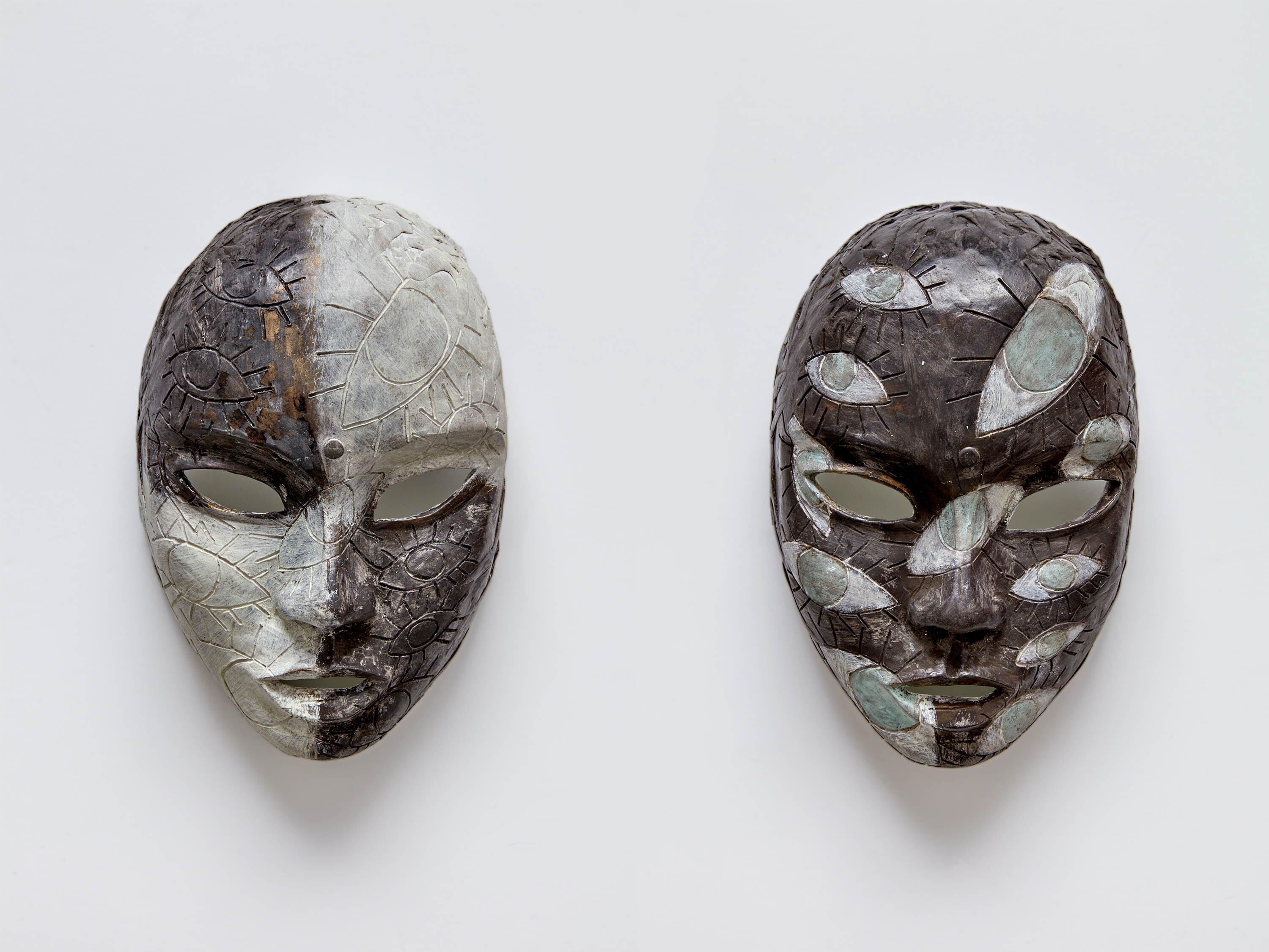 Chiki, <i>Prop Masks 3</i>, 2025. Bronze cast, titanium white patina, <br> each mask  9 7/8 x 5 7/8 x 4 in (25 x 15 x 10 cm)